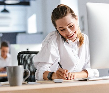 Woman smiling while working in office