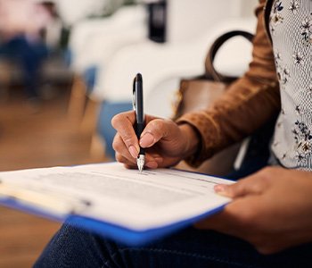 Patient filling out forms in lobby