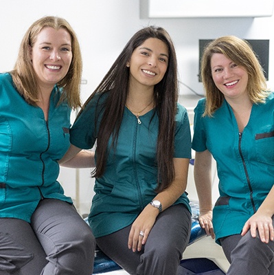 Three female dental team members