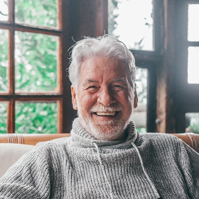 Closeup of senior man smiling at home