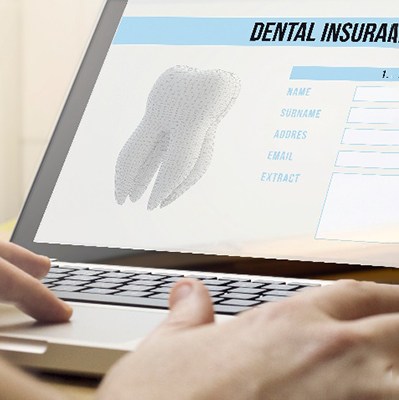 Patient reviewing dental insurance information on the computer