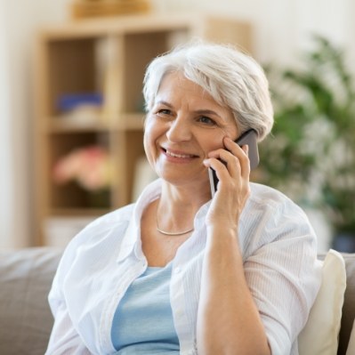 Woman calling for emergency dentistry