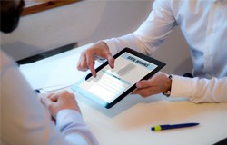 Patient reviewing dental insurance form on tablet