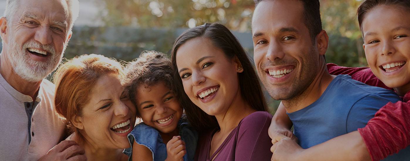 Family with healthy smiles after visiting the dentist in Worcester Massachusetts