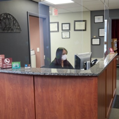 Dental team member reviewing dental insurance plan