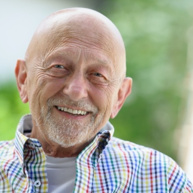 Man smiling after surgical tooth extraction