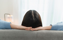 a dental implant patient resting at home 