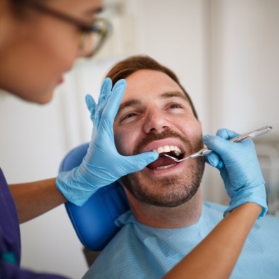 Patient receiving oral cancer screening