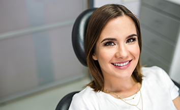 Woman smiling during preventive dentistry visit