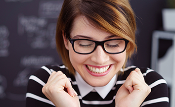 Woman with healthy smile after periodontal therapy