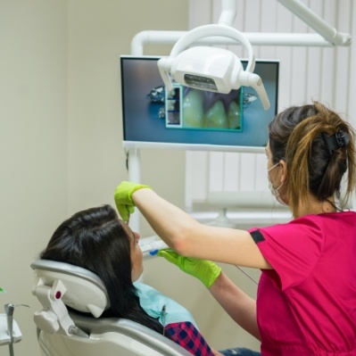 Dentist using intraoral camera to capture smile images