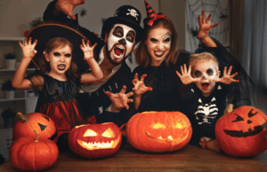 a family wearing Halloween costumes and smiling