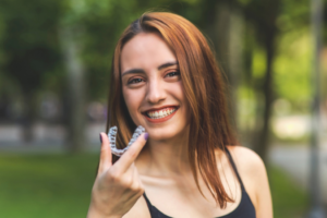 an Invisalign patient smiling during Halloween